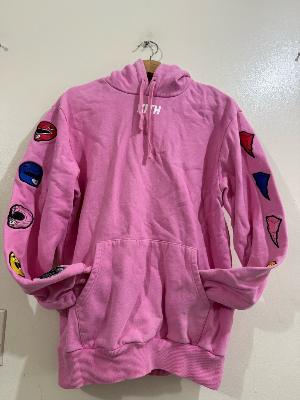 Kith Pink Pullover Hoodie with Graphic Sleeve Patches